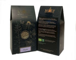 Zwei schwarze Verpackungen mit goldener Schrift mit Thymian. 